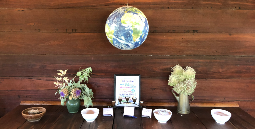 A globe suspended over a Buddhist altar at The Origins Centre, Balingup, Western Australia, photo by Saskia Abrahms-Kavunenko.